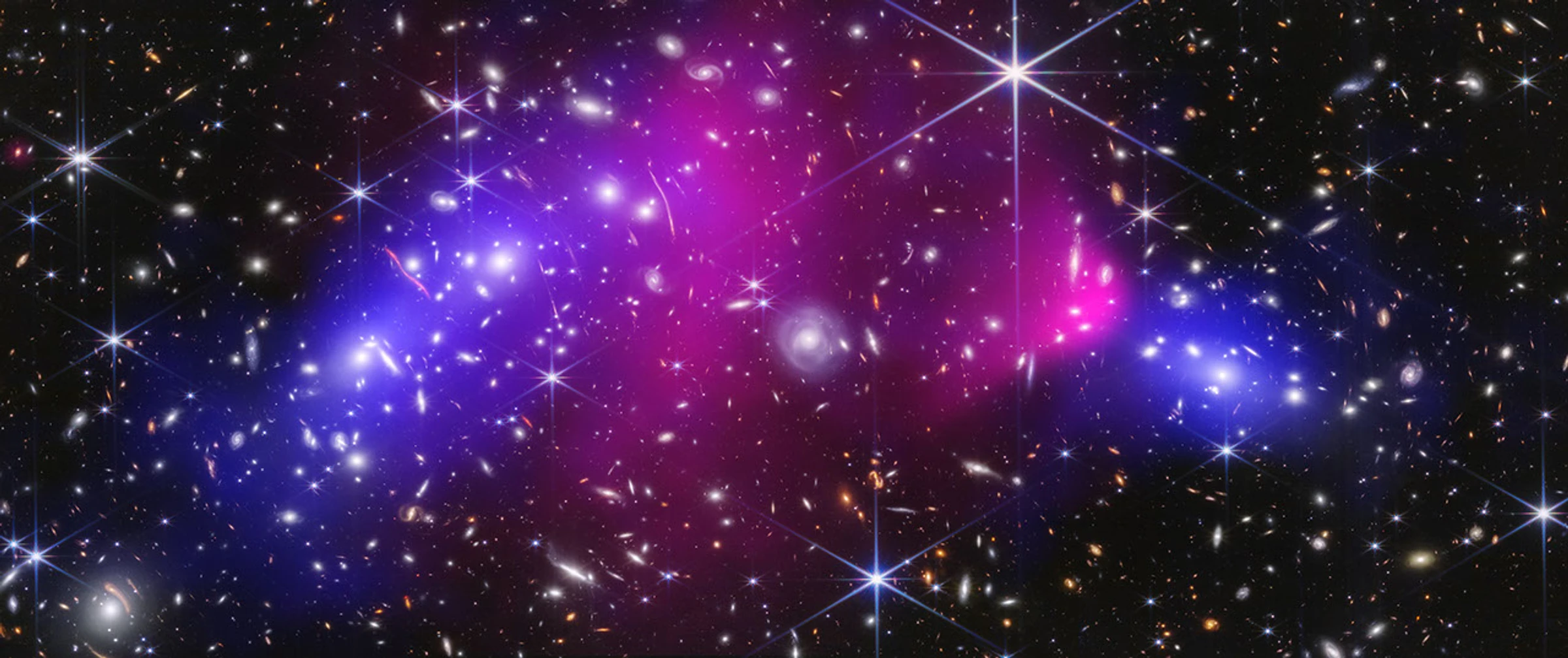 The colliding galaxy clusters of the Bullet Cluster, with pink X-ray-emitting gas offset from blue regions mapping mass inferred through gravitational lensing.